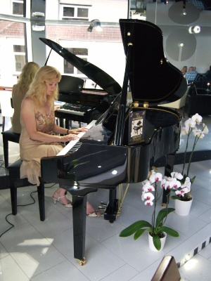 Rosalind playing Suzuki Grand Piano
